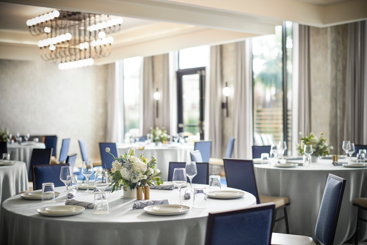 Reception room with banquet tables and florals